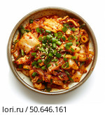 Kimchi with chopped green onions and sesame seeds in a bowl. Стоковое AI-изображение, AI-художник Иван Рябоконь / Фотобанк Лори