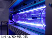 Powerful uv light inside medical equipment sterilizing machine. Стоковое AI-изображение, AI-художник Иван Рябоконь / Фотобанк Лори