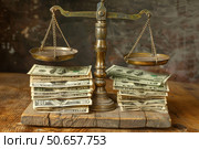 Balancing money and justice, weighing financial concepts on vintage scales. Стоковое AI-изображение, AI-художник Иван Рябоконь / Фотобанк Лори