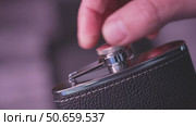 Flask for alcohol with metal glasses in a box. Стоковое видео, видеограф Потийко Сергей / Фотобанк Лори