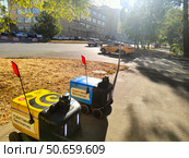 Роботы-доставщики на улице города. Редакционное фото, фотограф Мария Сергеева / Фотобанк Лори