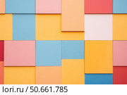 Colorful wall showing modern architectural design with varying shapes and sizes. Стоковое AI-изображение, AI-художник Иван Рябоконь / Фотобанк Лори
