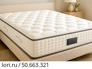 Luxury soft mattress on stylish bed in modern bedroom, promoting restful sleep, orthopedic support, white bedding, minimal design, comfortable healthy lifestyle. Стоковое AI-изображение, AI-художник Павел Муравьев / Фотобанк Лори