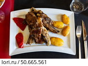Fried fatty and juicy lamb and vegetable side dish of potato and bell pepper. Стоковое фото, фотограф Яков Филимонов / Фотобанк Лори