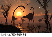 Omeisaurus and duckbill dinosaurs graze in a freshwater lake. Стоковое фото, фотограф Mark Stevenson/Stocktrek Images / ТАСС / Фотобанк Лори