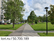 Moscow, Russia - June 24. 2024. Boulevard with a bike path in Zelenograd. Редакционное фото, фотограф Володина Ольга / Фотобанк Лори