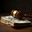 A wooden judge's gavel sits on top of a stack of banknotes. Стоковое AI-изображение, AI-художник RamA / Фотобанк Лори