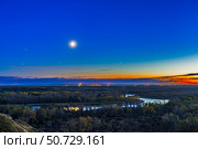 Moon with Antares, Mars and Saturn over Bow River in Alberta, Canada. Стоковое фото, фотограф Alan Dyer/Stocktrek Images / ТАСС / Фотобанк Лори