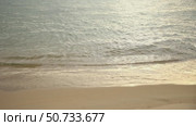 Sunset sandy beach with ocean in the background. Sea waves near the tropical coast on a sunny day. Cruise. Landscape of a summer sea beach with white sand. Slow motion footage. Стоковое видео, видеограф Ирина Михайличенко / Фотобанк Лори