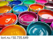 Colorful paint cans showing vivid colors for creative projects. Стоковое AI-изображение, AI-художник Иван Рябоконь / Фотобанк Лори