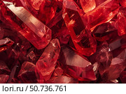 Sparkling red crystal points glimmering in darkness. Стоковое AI-изображение, AI-художник Иван Рябоконь / Фотобанк Лори