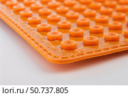 Orthopedic insole for flatfoot treatment showing its bumps and ridges. Стоковое AI-изображение, AI-художник Иван Рябоконь / Фотобанк Лори