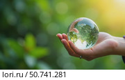 Hand holding crystal earth globe. Earth Day. Environment day, save clean planet, ecology concept. Стоковое AI-видео, аниматор Sergey Grishin / Фотобанк Лори