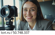 Smiling businesswoman looking at camera webcam make conference business call, video blogger making social content, happy girl creating video course. Стоковое AI-видео, аниматор Sergey Grishin / Фотобанк Лори