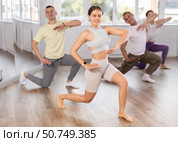 Young woman practicing aerobic dance in training hall. Стоковое фото, фотограф Яков Филимонов / Фотобанк Лори