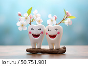 Healthy teeth smiling with spring flowers representing oral hygiene. Стоковое AI-изображение, AI-художник Иван Рябоконь / Фотобанк Лори