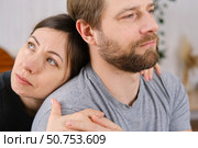 Mature couple hugging hugging each other kissing at home bedroom. Intimate Moment. Tender embrace shared between a loving middle age man and woman, husband and wife. Deep love. Low key, cinematic. Стоковое фото, фотограф Марина Демидюк / Фотобанк Лори