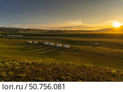 Landscape with yurts and mountains at sunset. Стоковое фото, фотограф Михаил Коханчиков / Фотобанк Лори