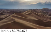 Aerial view of sand dunes in desert at sunset. Стоковое фото, фотограф Михаил Коханчиков / Фотобанк Лори