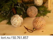 Christmas tree decorations, gold and white glass balls, green spruce branches.Christmas concept. Стоковое фото, фотограф Оксана Шведкова / Фотобанк Лори