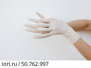 Female hands wearing disposable gloves. Стоковое фото, фотограф Акимова Надежда / Фотобанк Лори