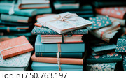 Stack of Vintage Notebooks and Journals with Teal and Coral Covers. Стоковое AI-изображение, AI-художник Данила Большаков / Фотобанк Лори