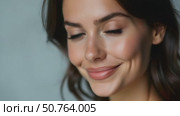 Close-up of a Woman With Stunning Blue Eyes Against a Soft Grey Background; a Nod to Beauty Salons and Skincare Brands. Стоковое AI-видео, аниматор Sergey Grishin / Фотобанк Лори