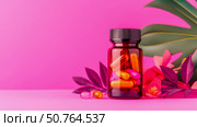 Amber Bottle of Capsules with Tropical Flowers on Pink Surface. Стоковое AI-изображение, AI-художник Данила Большаков / Фотобанк Лори