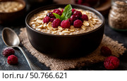 Delicious Oatmeal Breakfast Bowl with Raspberries and Oats: A Healthy and Appetising Morning Meal. Стоковое AI-изображение, AI-художник Данила Большаков / Фотобанк Лори