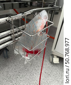 Postoperative drain in a bedside basket. A tube draining red fluid from the body into a vacuum collection bag. Стоковое фото, фотограф Vadzim Yakubovich / Фотобанк Лори