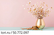 Golden Coins and Pink Flowers in a Gold Vase on Pastel Background: Wealth and Prosperity Concept. Стоковое AI-изображение, AI-художник Данила Большаков / Фотобанк Лори