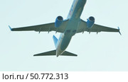 Moscow, Russia - June 17, 2025: Jet airliner climbing after takeoff against a white sky. Редакционное видео, видеограф Mikhail Davidovich / Фотобанк Лори