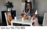Children Drinking Juice on a Birthday Party at Home. Siblings, girls and a boy together celebrating a party, eating cake sitting at festive table. Little Kid Celebration. Surprise. Low key. Стоковое видео, видеограф Марина Демидюк / Фотобанк Лори