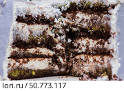 Cake in the cut, chocolate cake with Dubai chocolate filling, piece of cake, dessert for tea, birthday cake, sponge cake with cream. Стоковое фото, фотограф Photojuli / Фотобанк Лори