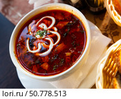 Traditional Russian meat soup solyanka with assorted meat and sausages and vegetables. Стоковое фото, фотограф Яков Филимонов / Фотобанк Лори