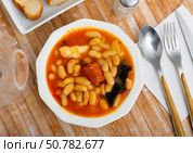 Tasty stew of asturian beans in gravy with sausages. Стоковое фото, фотограф Яков Филимонов / Фотобанк Лори