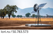 Water pumps and solar panels. Groundwater is pumped with a submersible pump from clean energy or solar energy converted to electric energy on an agricultural farm. Стоковое AI-изображение, AI-художник ALLA YURTAYEVA / Фотобанк Лори