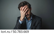 Depressed businessman lost his business. Destroyed businessman. Concept of business loss, bankruptcy and crisis. Collectors calls. Стоковое AI-видео, аниматор Sergey Grishin / Фотобанк Лори