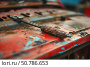 Rusty ratchet wrench lying on a rusted car hood, repairing or abandoning. Стоковое AI-изображение, AI-художник Иван Рябоконь / Фотобанк Лори