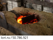 Ferrous metal billet is melted in an induction furnace closeup. Стоковое фото, фотограф Татьяна Яцевич / Фотобанк Лори