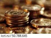 Stack of gold coins representing wealth and investment growth. Стоковое AI-изображение, AI-художник Иван Рябоконь / Фотобанк Лори