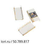 Микросхемы памяти с возможностью стирания информации УФ светом. Components for computer and Several electric chips. The photo on the white background. Стоковое фото, фотограф Татьяна Д / Фотобанк Лори