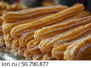 Delicious churros covered in sugar forming a tasty pile, sweet temptations. Стоковое AI-изображение, AI-художник Иван Рябоконь / Фотобанк Лори