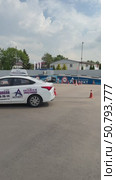 Moscow Russia  June 15 2025 Driving school / Training for a parallel parking exam concept.Modern car on driving school test track with traffic cones.Driver training area with parked cars. Редакционное видео, видеограф Zita Khasanova / Фотобанк Лори