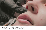 Lip Enhancement Procedure using Filler Injection for a fuller and more youthful appearance. Стоковое видео, видеограф Olesia Kondrateva / Фотобанк Лори