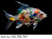 Transparent fish filled with plastic debris swimming in the ocean depths. Стоковое AI-изображение, AI-художник Иван Рябоконь / Фотобанк Лори
