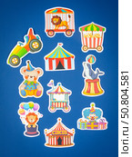 Novosibirsk, Russia - March 1, 2025: Cartoon style vinyl stickers featuring colorful circus characters and animals on a bright blue background. Редакционное фото, фотограф Виталий Сова / Фотобанк Лори