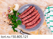 Raw sausages longaniza prepared for barbecue. Traditional Catalan meat products. Стоковое фото, фотограф Яков Филимонов / Фотобанк Лори