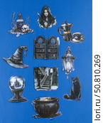 Novosibirsk, Russia - May 30, 2025: Vinyl stickers featuring mystical and enchanting witch-inspired designs in a dark, elegant style. These stickers depict cauldrons, spellbooks, crescent moons, pentagrams, magical symbols, and mysterious figures adorned with robes and hats. Редакционное фото, фотограф Виталий Сова / Фотобанк Лори