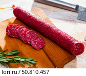 Sliced dry cured sausage Fuet Nobleza. Стоковое фото, фотограф Яков Филимонов / Фотобанк Лори
